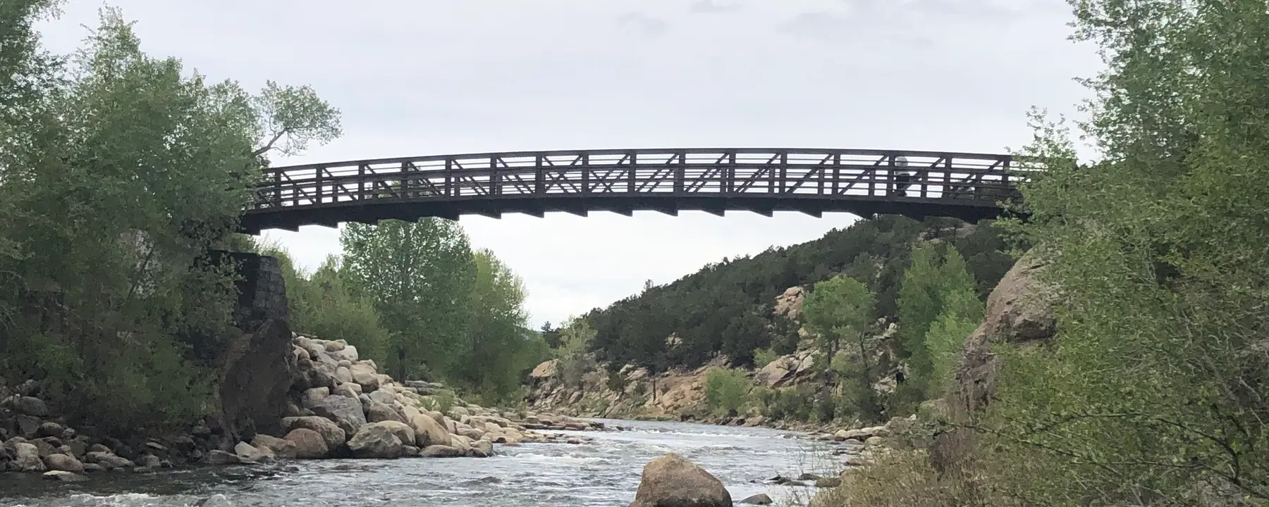 A bridge spanning a quiet river