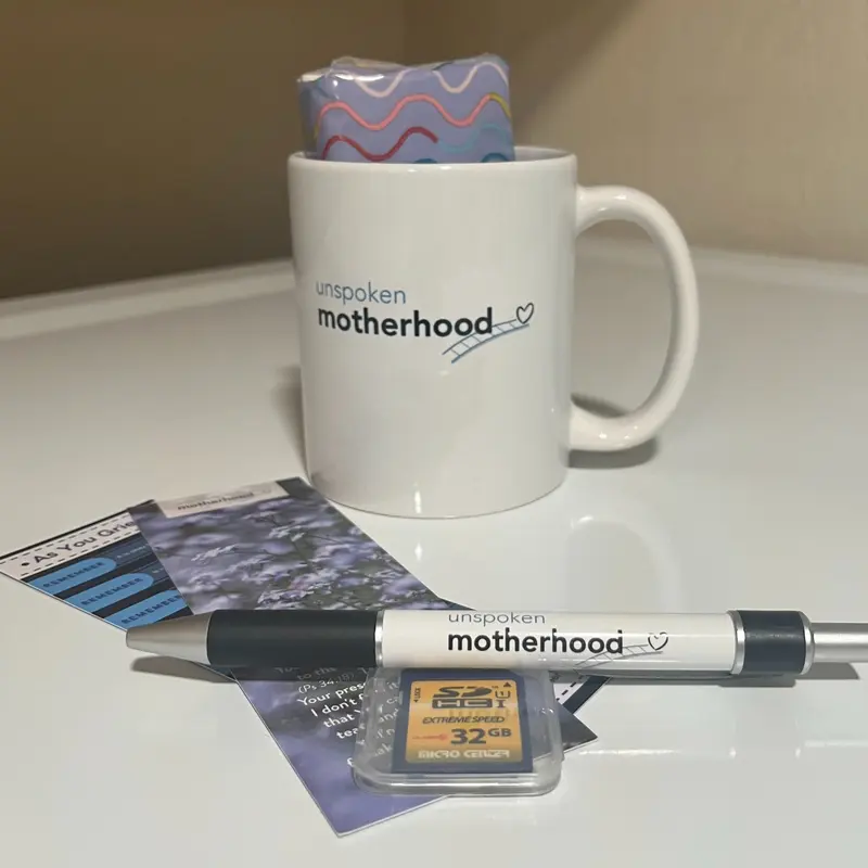 An Unspoken Motherhood mug and printed resources